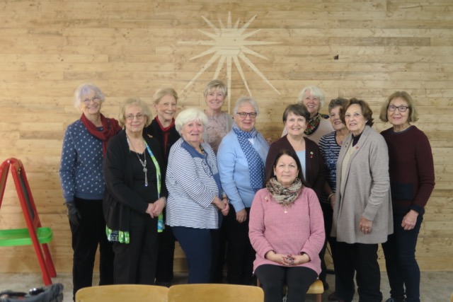 The members gather for a group photo