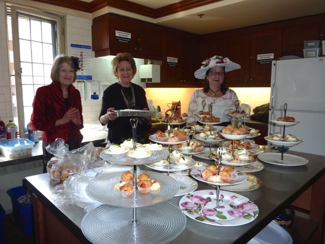 complete with miniature sandwiches and a multitude of delicious tiny cakes