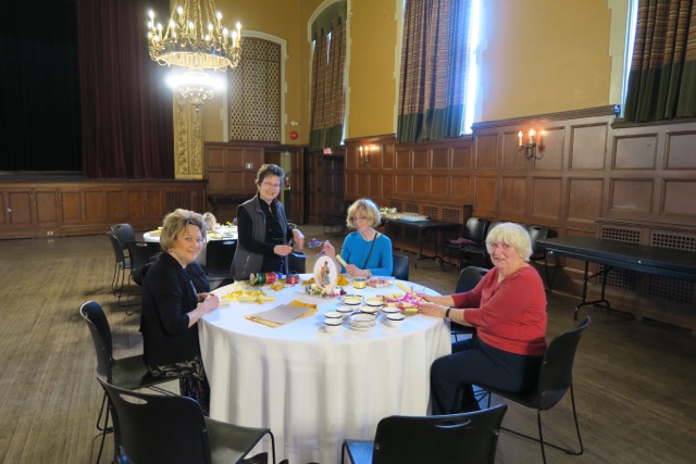 Timmy, Louise, Donna, and Gail prepare our gift of a drawing of Dickens' characters.
