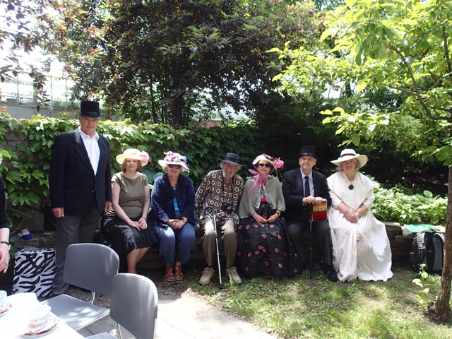 Clive, Alexandra, Gail, Frank, Louise, Barry, and Maura are ready for tea