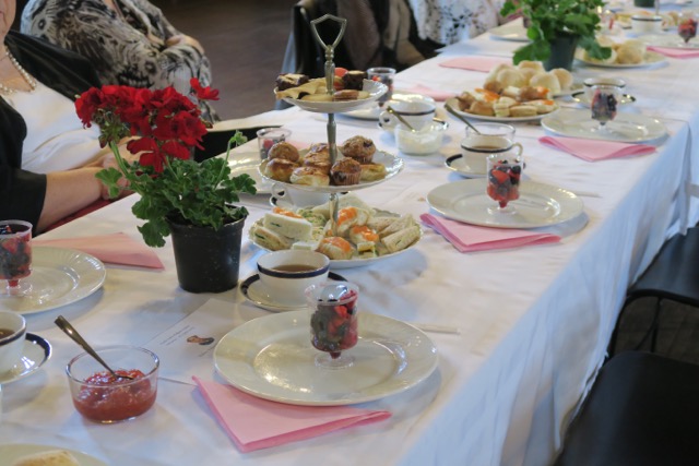 Refreshments consisted of berry salad, a variety of dainty and delicious finger sandwiches, butter scones with jam and clotted cream and several kinds of cookies, muffins and squares.