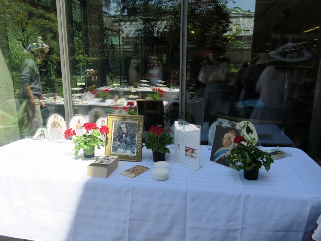 Framed pictures of Charles Dickens and Queen Victoria adorned a large side table along with flowers, cut-outs of Dickens characters and some copies of our books for next year.